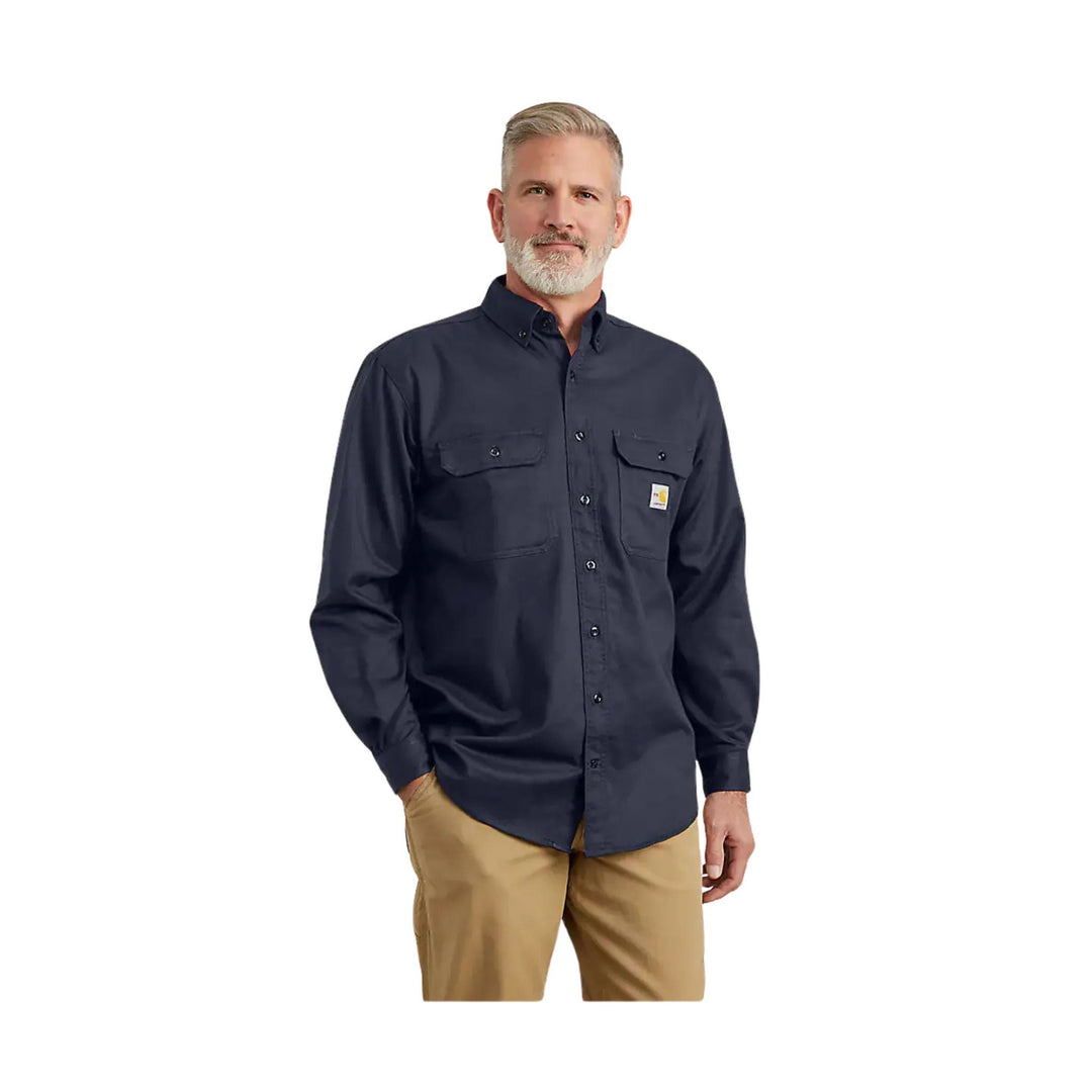 Dark navy long-sleeve button-up work shirt with two chest pockets and tan pants