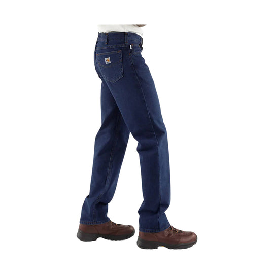 Dark blue straight-leg jeans with a rear patch pocket and brown work boots