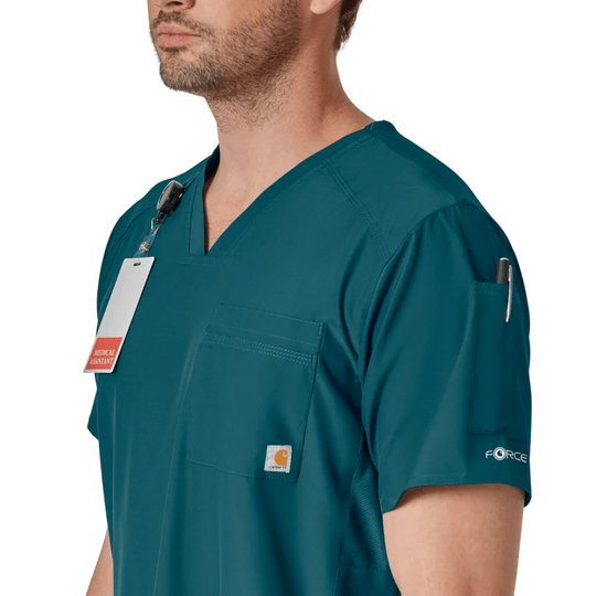 Teal short-sleeve V-neck scrub top with chest pocket, sleeve pen pocket, and hanging medical assistant tag