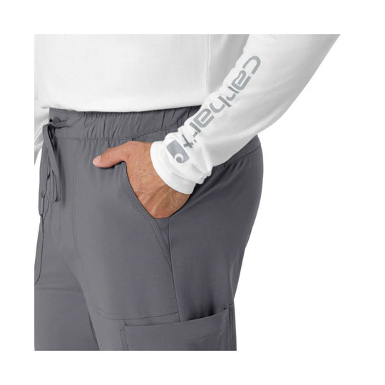 White long-sleeve top with gray jogger scrub pants and side pockets