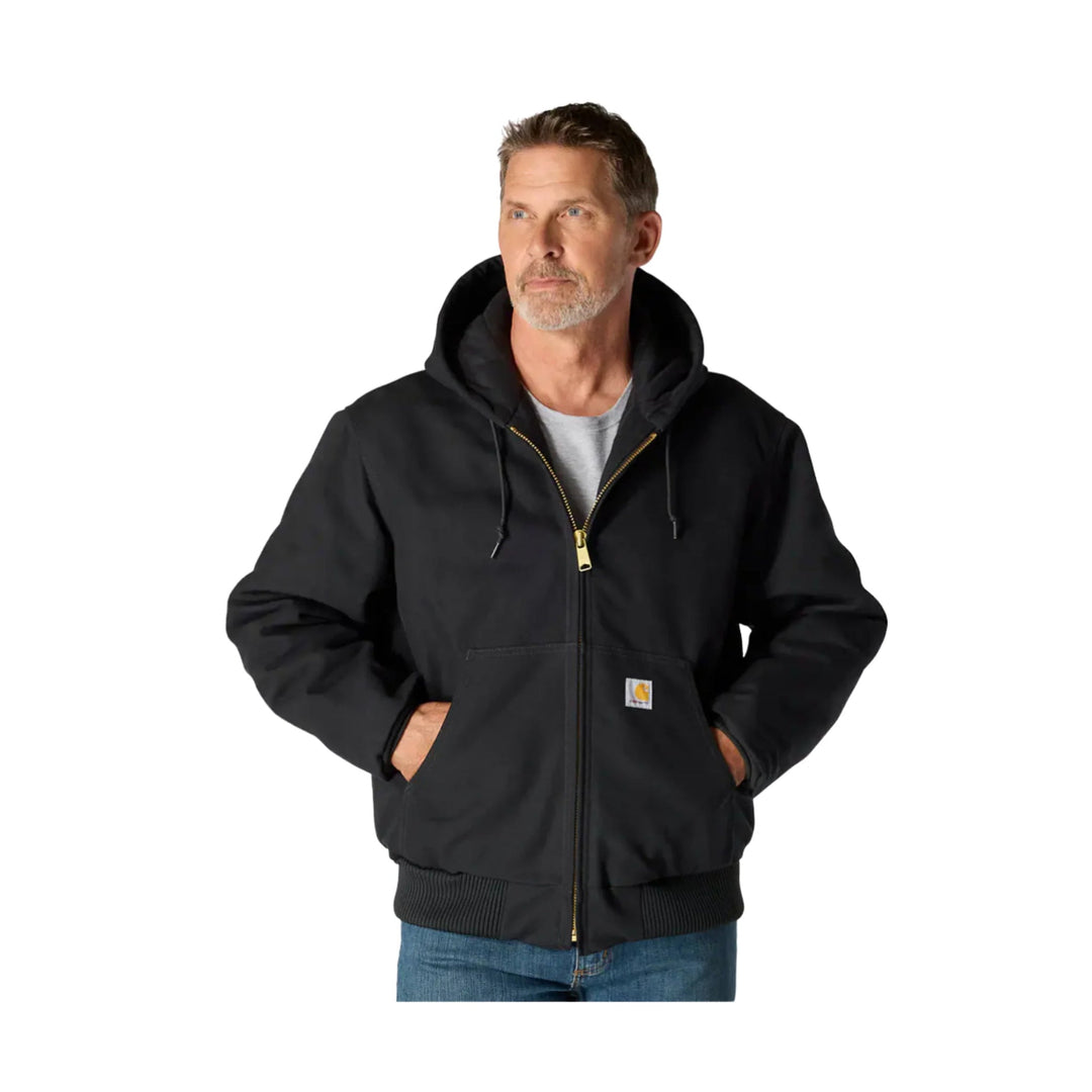Black hooded zip-front work jacket with drawstrings, front hand pockets, and ribbed hem over a gray T-shirt