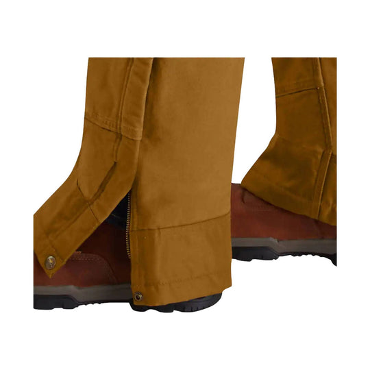 Brown insulated bib overalls with leg openings over black work boots