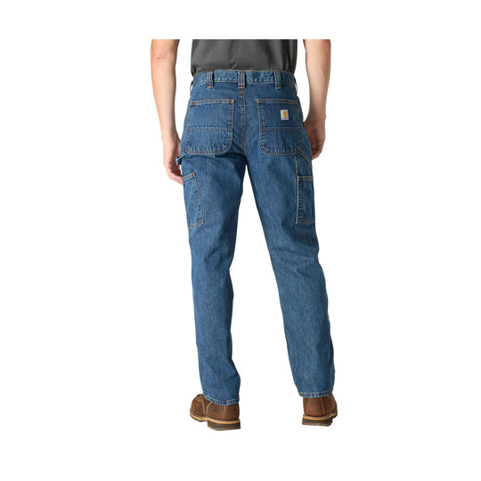 Back view of blue denim work pants with large rear and cargo pockets