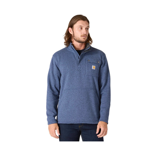 Blue quarter-zip pullover with chest pocket and logo patch