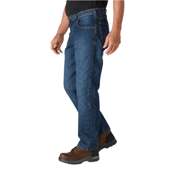 Blue relaxed-fit five-pocket jeans shown on a model with brown work boots.