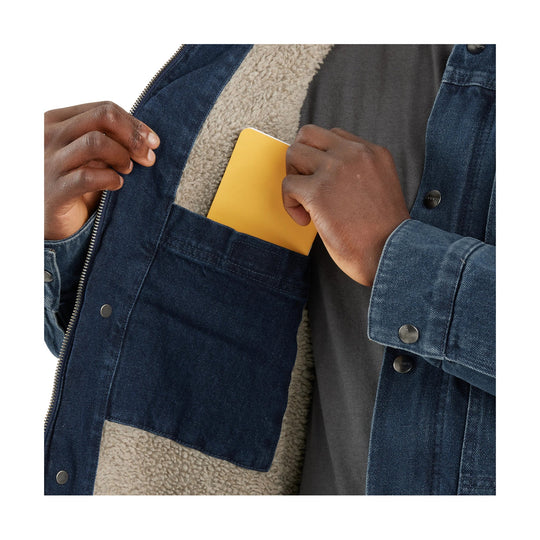 Denim jacket with sherpa lining and a yellow card in the chest pocket