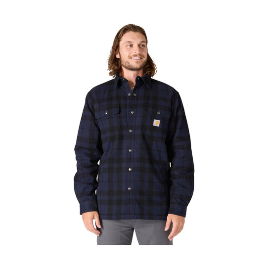 Navy and black plaid button-up shirt jacket with chest pockets and a Carhartt logo patch