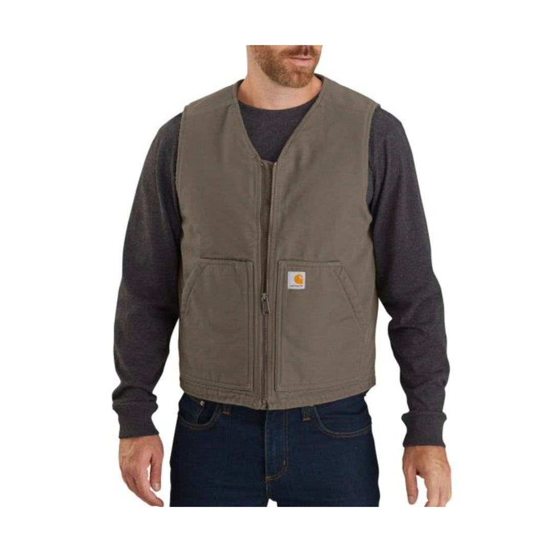 Brown work vest with front zipper, two patch pockets, and a small Carhartt logo patch