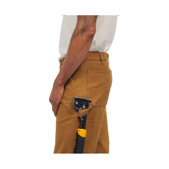 Brown work pants with a side utility pocket and attached knife holder