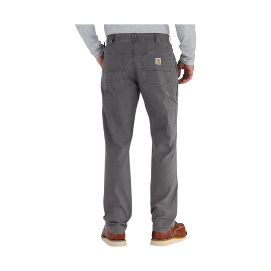 Gray work pants shown from the back with rear patch pockets and brown work shoes