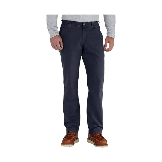 Navy straight-leg pants on a male model with brown shoes