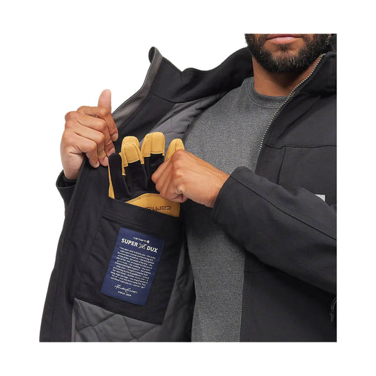 Black insulated jacket shown open with a chest pocket, interior label patch, and work gloves tucked inside