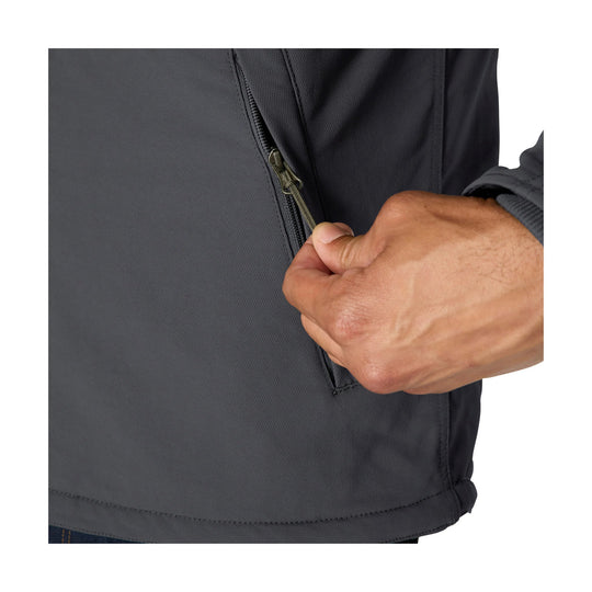 Close-up of a dark gray insulated jacket showing a zippered side pocket being opened