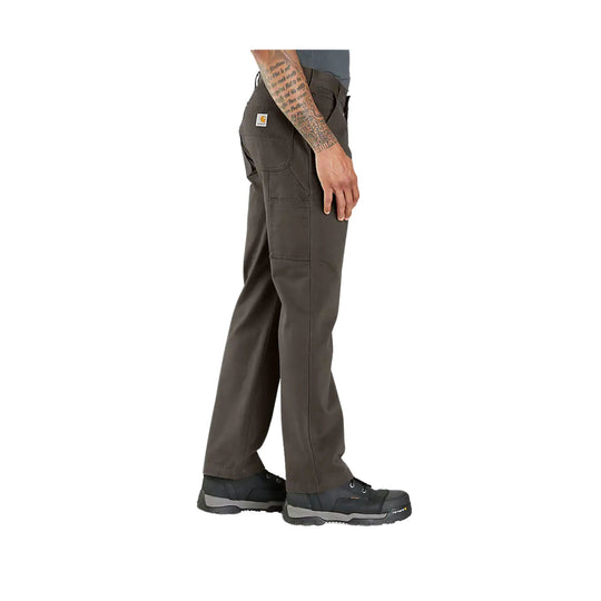 Person wearing dark brown pants on a white background