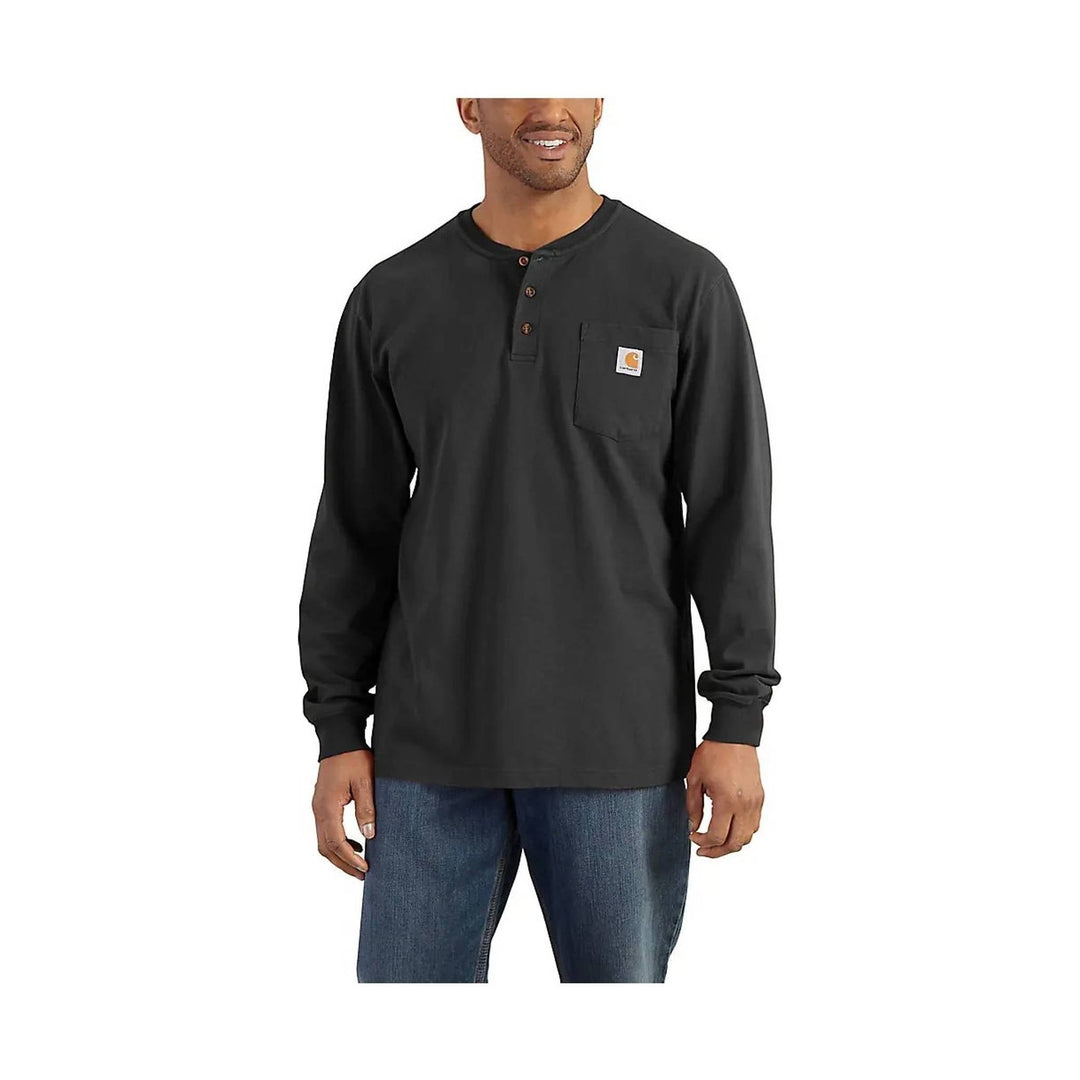 Man wearing a black long-sleeve henley shirt with a visible brand logo on a white background