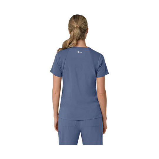 Blue short-sleeve scrub top shown from the back with a V-neck and raglan-style shoulder seams