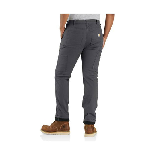 Dark gray women’s work pants shown from the back with cargo pockets and brown work boots