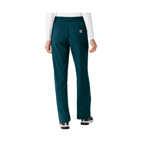 Teal scrub pants with elastic waist, front patch pockets, and a small Carhartt logo patch on the thigh