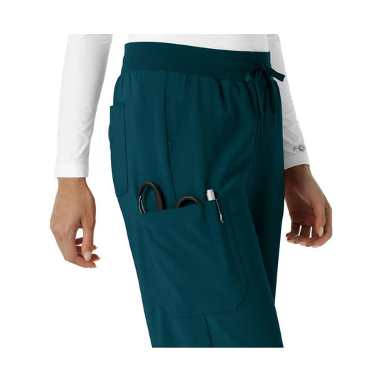 Teal scrub pants with elastic waistband, side cargo pocket, and boot-cut leg