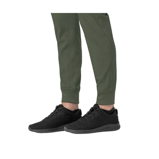 Black knit lace-up sneakers worn with olive jogger pants, shown from the side