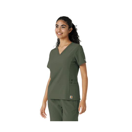 Olive scrub top and pants on a model, shown in three-quarter view