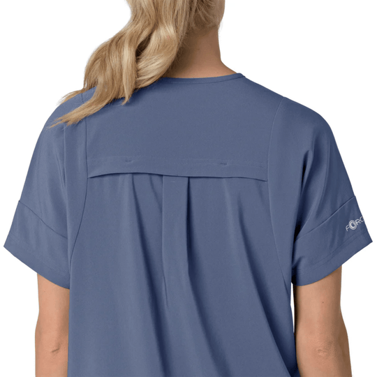Blue short-sleeve V-neck scrub top shown from the back with a pleated yoke and loose fit