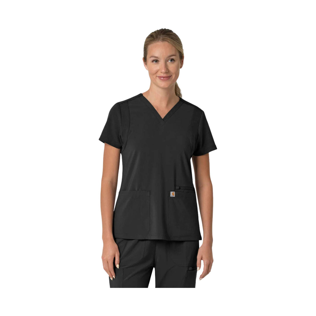 Black V-neck scrub top with short sleeves, two front pockets, and a small chest logo tag