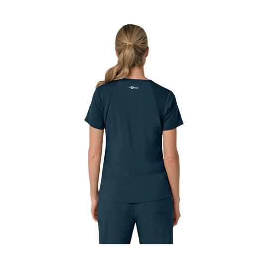 Navy short-sleeve scrub top shown from the back with a small FORCE logo at the upper center
