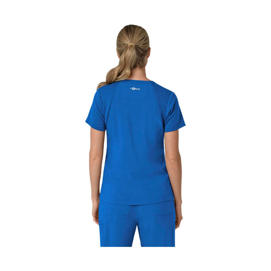 Blue scrub top shown from the back with short sleeves and a V-neck, paired with matching scrub pants.
