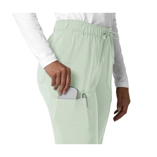 Mint green scrub pants with elastic waist, cargo pocket, and side drawstring, shown from the hip