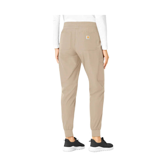 Khaki jogger scrub pants with elastic cuffs, patch pockets, and a small logo patch on the back.