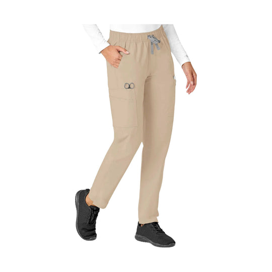 Khaki straight-leg scrub pants with elastic waist, cargo pockets, and black sneakers