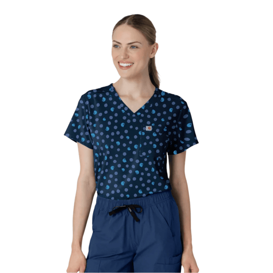 Navy scrub top with blue dot pattern and chest pocket