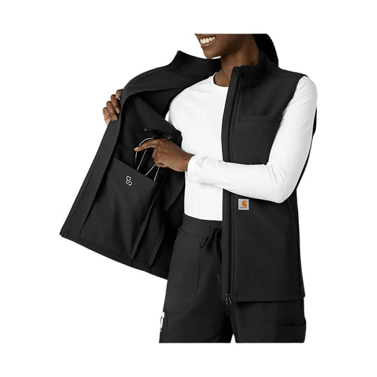 Black zip-front fleece vest worn open over a white long-sleeve shirt