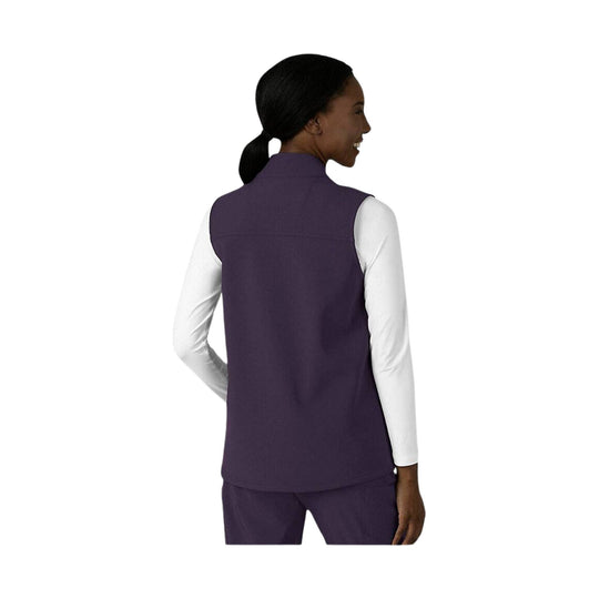 Woman wearing a plum fleece vest over a white long-sleeve shirt, shown from the back