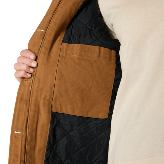 Brown quilted coat interior with black lining and an open front pocket, shown close up