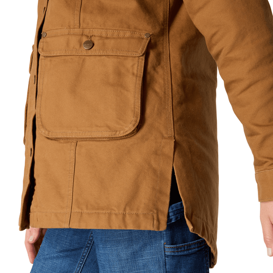 Brown canvas work coat with large front flap pocket and snap buttons, shown from the front.