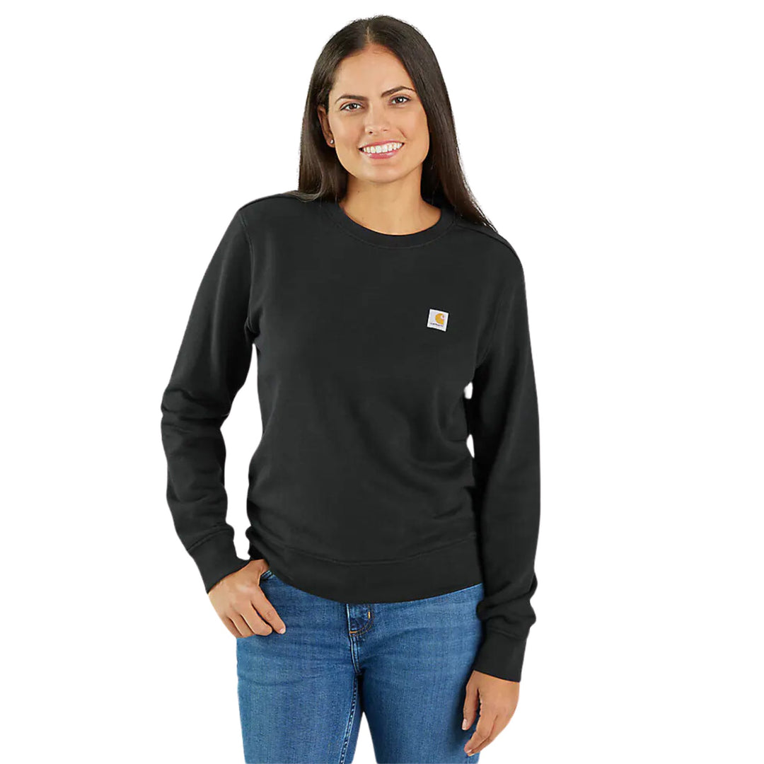 Black crewneck sweatshirt with a small chest logo patch, shown on a model