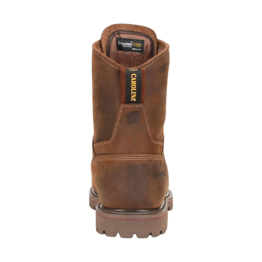 Brown leather boot with visible branding on a white background