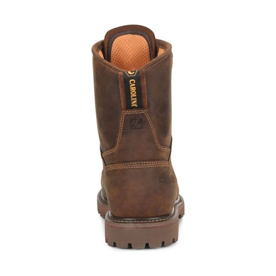 Rear view of a brown leather work boot with a lug sole and CAROLINA pull tab