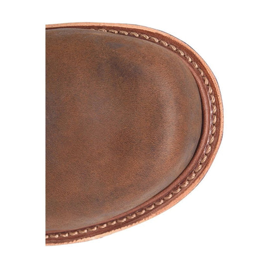 Brown leather boot toe with contrast stitching and a rounded welt detail