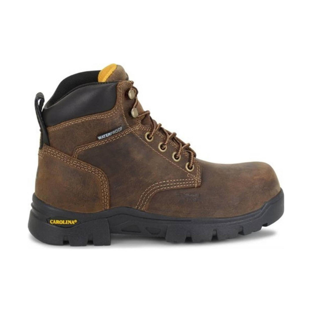 Brown work boot with black sole on a white background