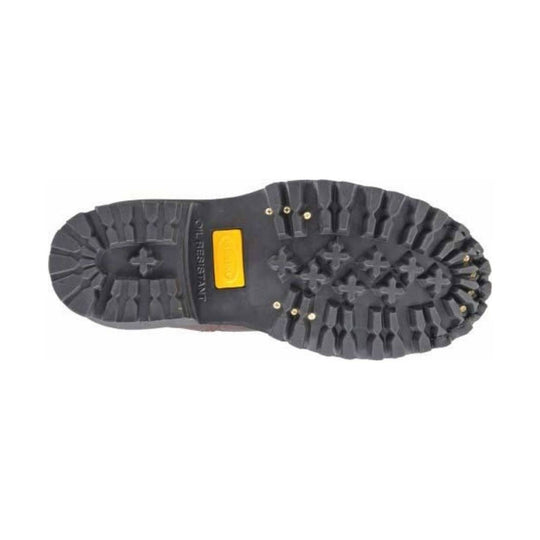 Close-up of a black boot sole with a yellow label on a white background