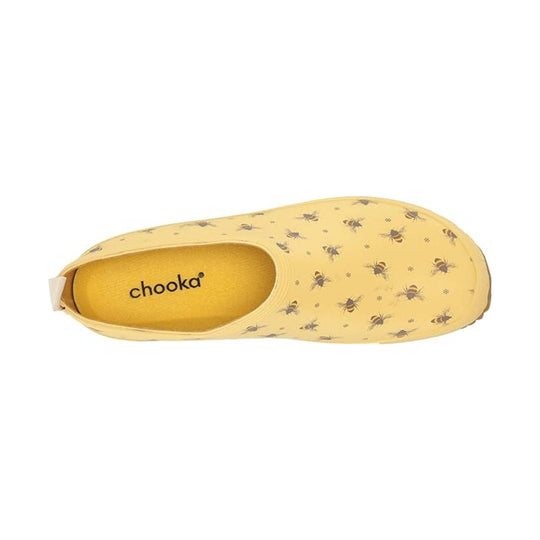 Yellow shoe with bee pattern on a white background