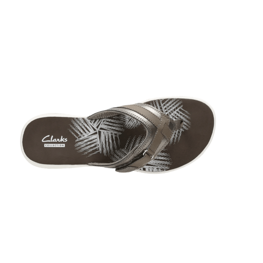 Brown thong sandal with white leaf pattern and Clarks Collection branding