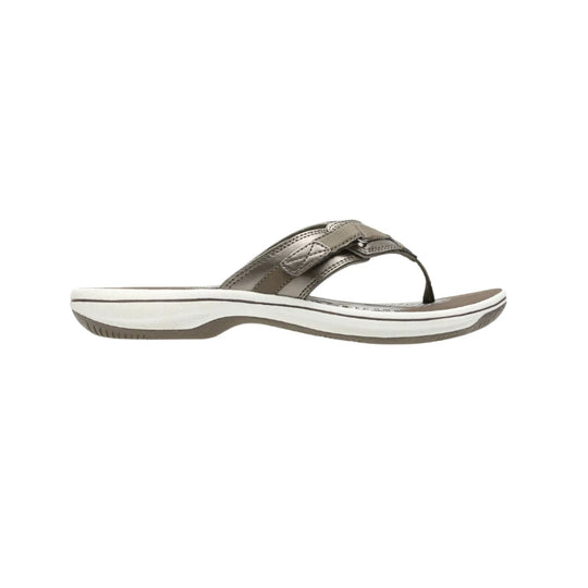 Taupe thong sandal with crossover straps and a white cushioned sole