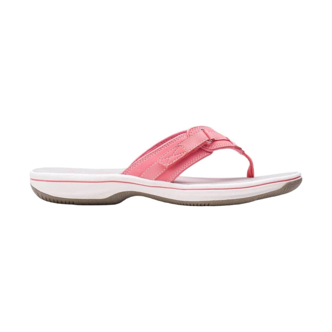 Pink thong sandal with a white cushioned sole and adjustable strap