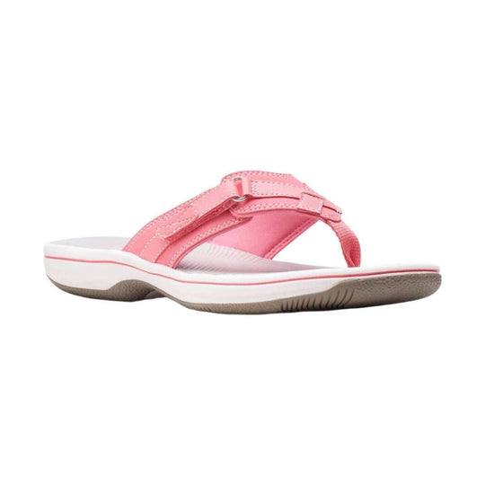 Pink sporty thong sandal with adjustable straps, white midsole, and tan treaded outsole