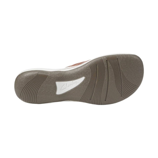Shoe outsole with brown tread and embossed Clarks logo