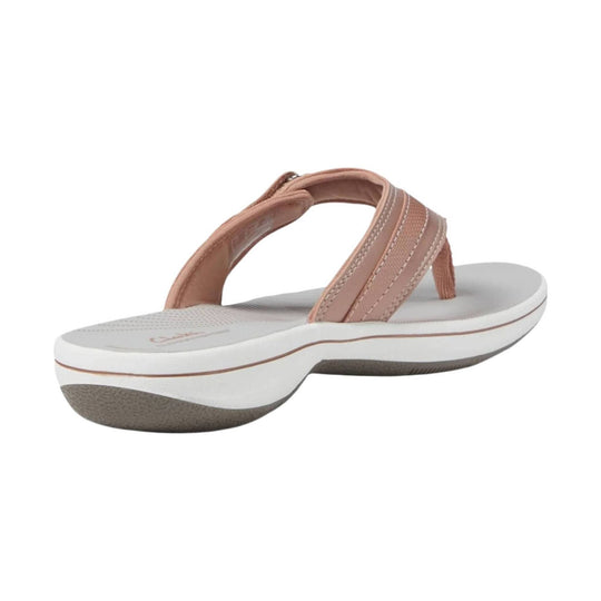 Rose gold thong sandal with white wedge sole and cushioned footbed